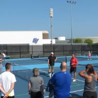 Everyone standing in a group before starting Pickleball.